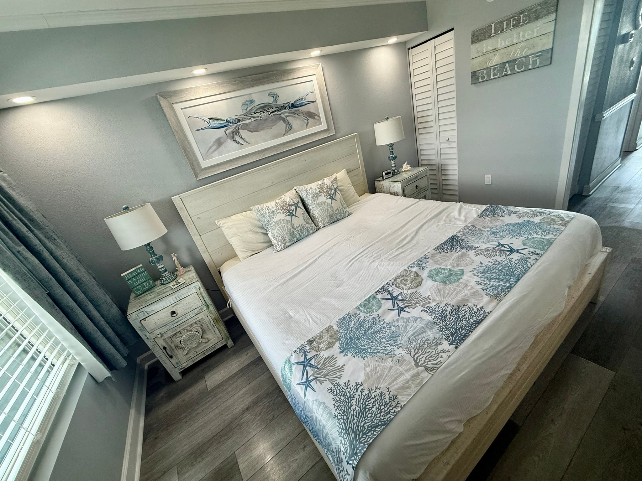 Coastal bedroom with crab artwork and beach decor
